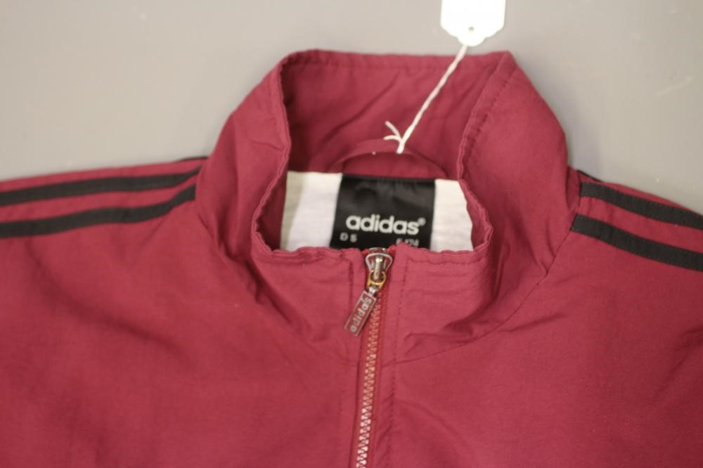 A BESPOKE ADIDAS BOLT MAKERS ARMS PUB FOOTBALL TEAM SPORTS KIT comprising of a maroon tracksuit top Image