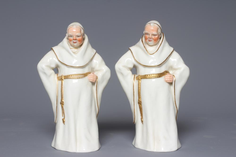 TWO ROYAL WORCESTER WHITE MONKS, 1883, modelled by James Hadley, each standing with his left hand on Image