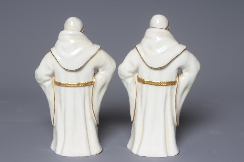 TWO ROYAL WORCESTER WHITE MONKS, 1883, modelled by James Hadley, each standing with his left hand on Image