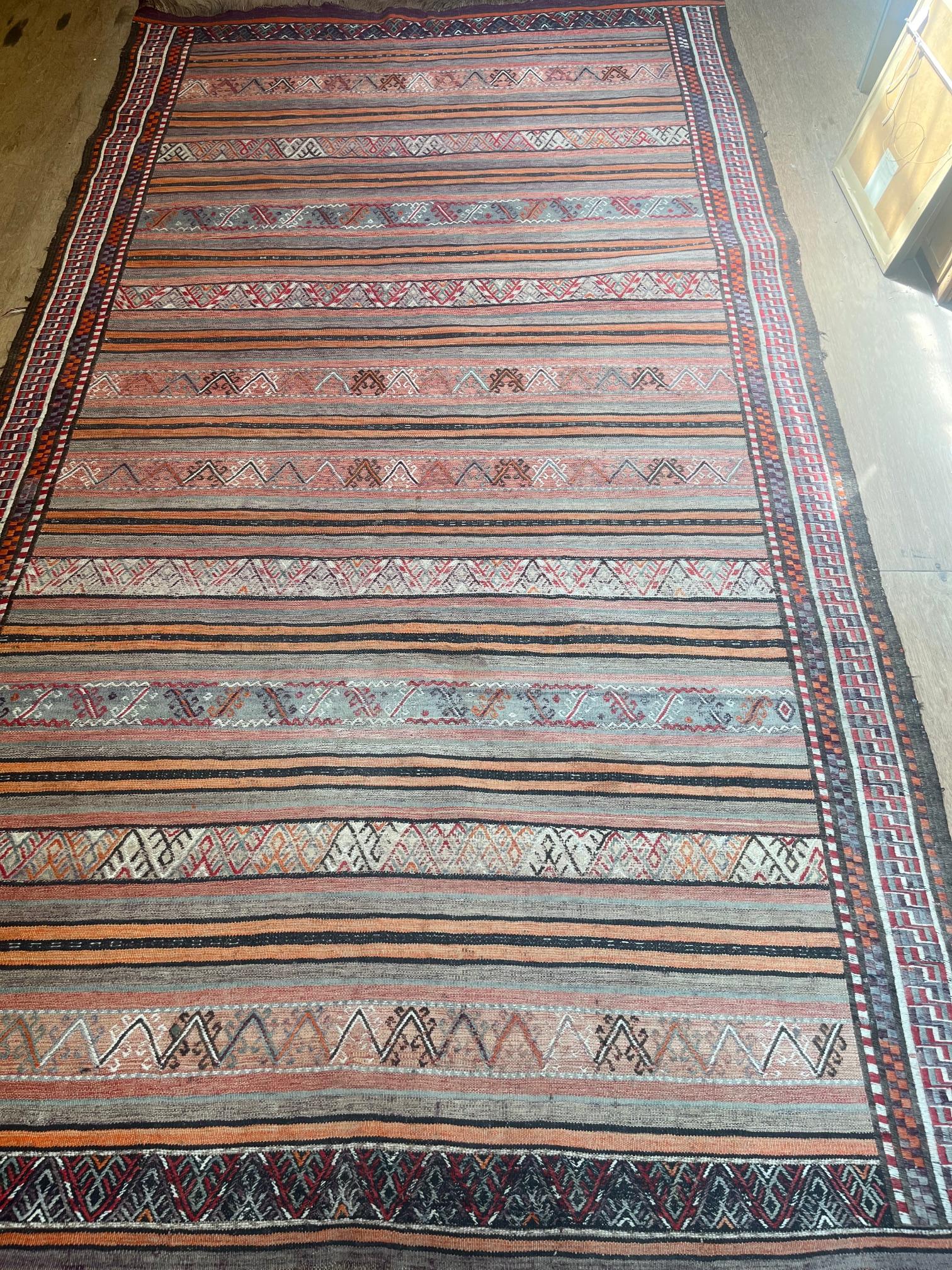 A PERSIAN KILIM FLAT WEAVE WOOL RUG Image