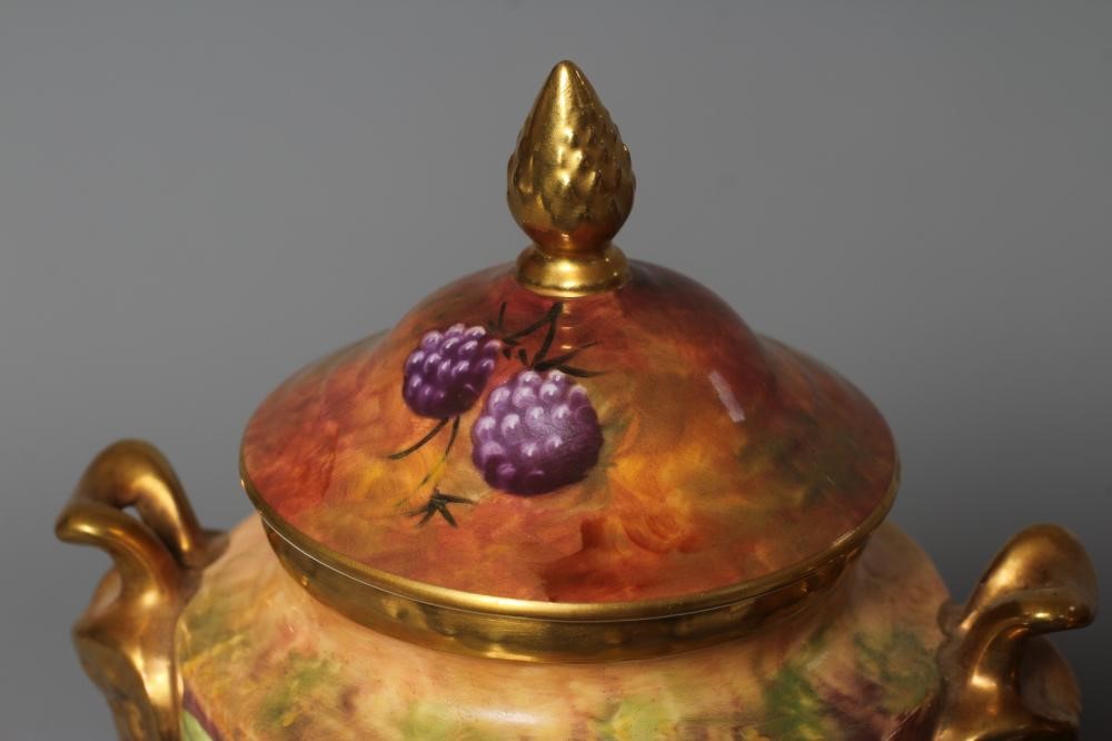 A PAIR OF COALPORT VASES AND COVERS Image