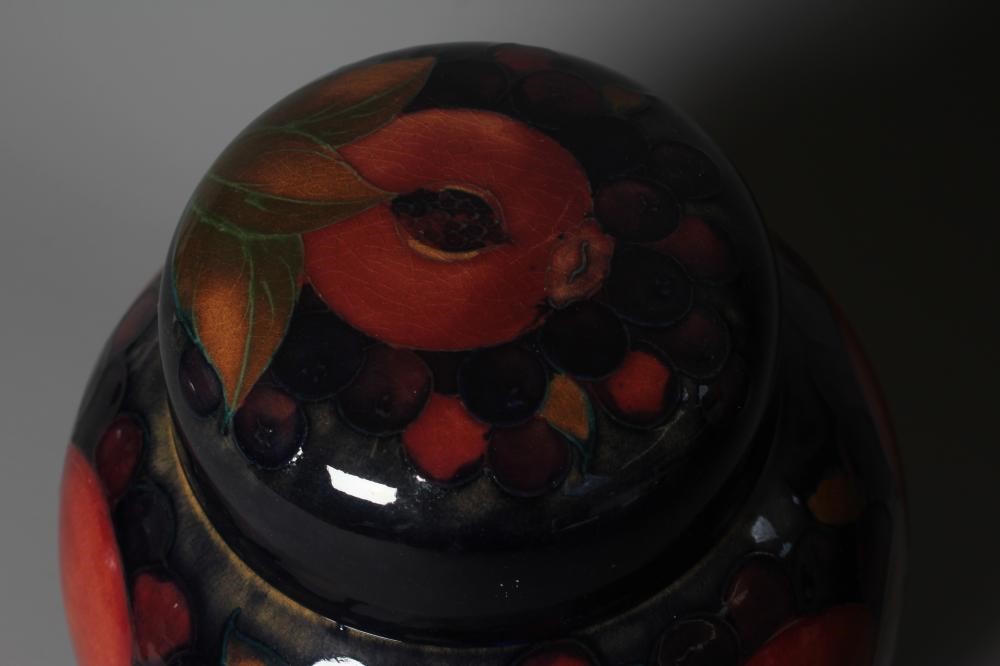 A MOORCROFT POTTERY POMEGRANATE PATTERN JAR AND COVER Image