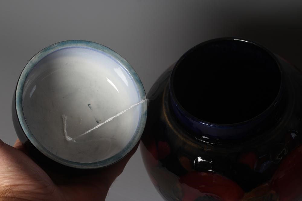 A MOORCROFT POTTERY POMEGRANATE PATTERN JAR AND COVER Image