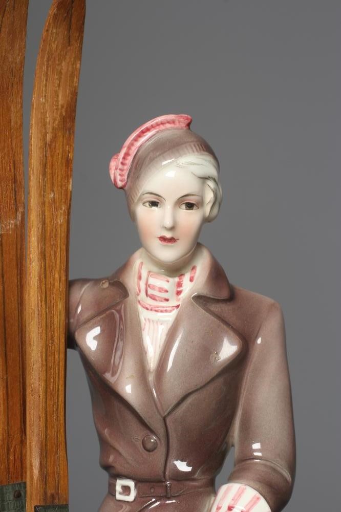 AN ART DECO KATZHUTTE EARTHENWARE FIGURE modelled as a young female skier wearing a brown trouser Image