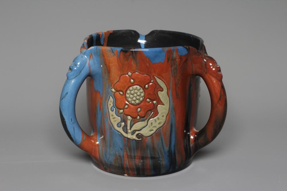 A LATE VICTORIAN ELTONWARE LARGE CYLINDRICAL TYG slip decorated in browns, green and blues with Image