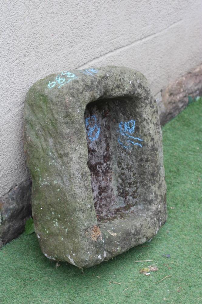 A SANDSTONE TROUGH of rough hewn D form, 24" w x 19" d x 9 1/2" h (Est. plus 24% premium inc. VAT) Image