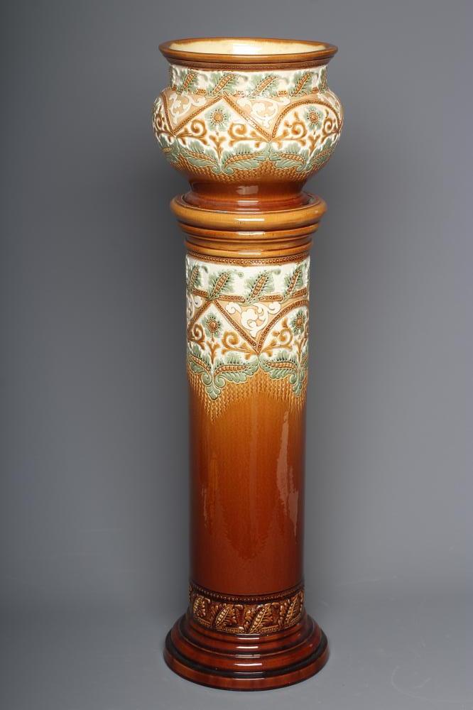 A BURMANTOFTS FAIENCE SMALL JARDINIERE AND STAND moulded and impressed with stylised flowers Image