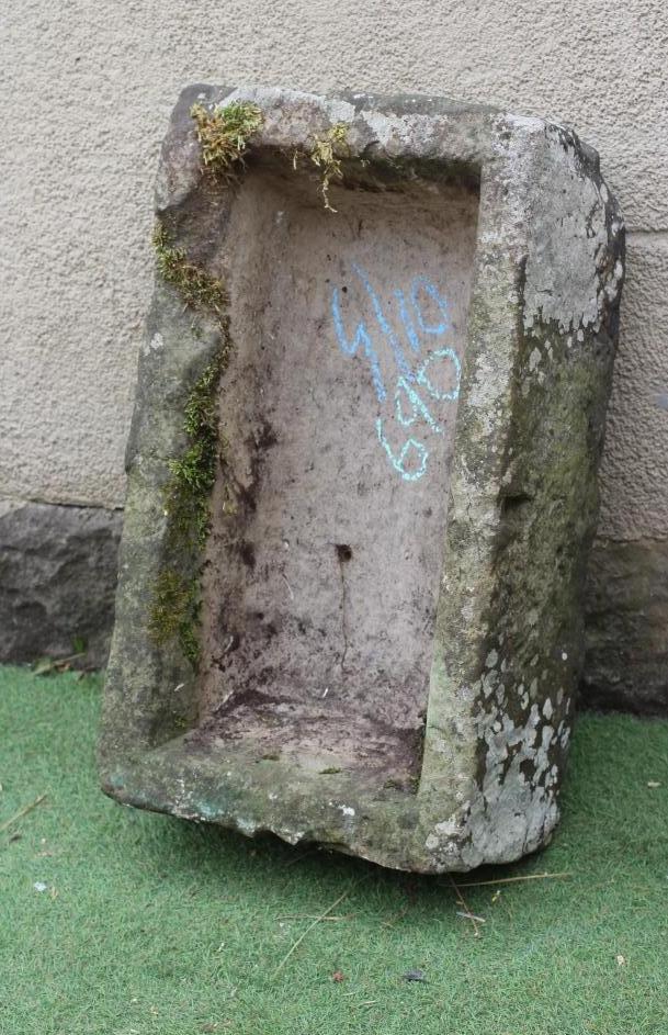 A SANDSTONE TROUGH of rough hewn oblong form, 28" w x 15 1/2" d x 9" h (Est. plus 24% premium inc. Image