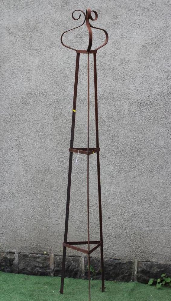 A HAND FORGED WROUGHT IRON TRIANGULAR PLANT SUPPORT with scrolled finial, 13 1/4" w x 91 1/4" h Image