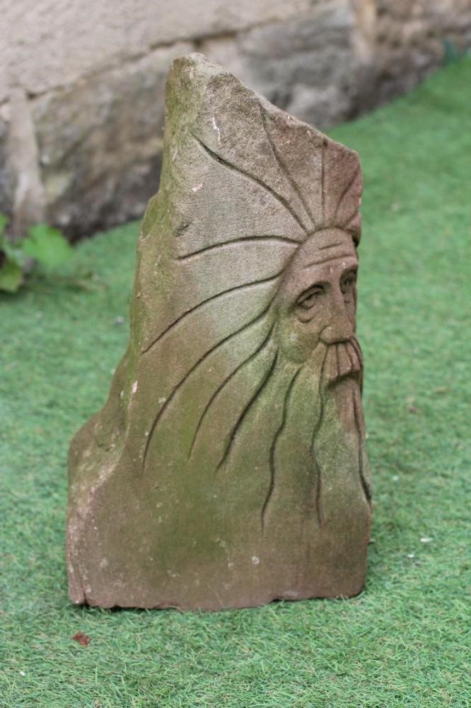 A HAND CARVED RED SANDSTONE CORBEL depicting a bearded male figure, 9" w x 8" d x 17" h (Est. plus Image