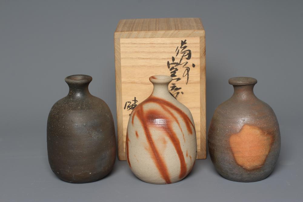 THREE BIZEN STONEWARE TOKKURI, one with a hidasuki firing, various incised marks, one possibly by Image