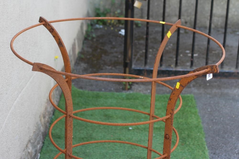 A HAND FORGED CAST IRON TREE GUARD of flared cylindrical form, 33" w x 39" h (Est. plus 24% premium Image