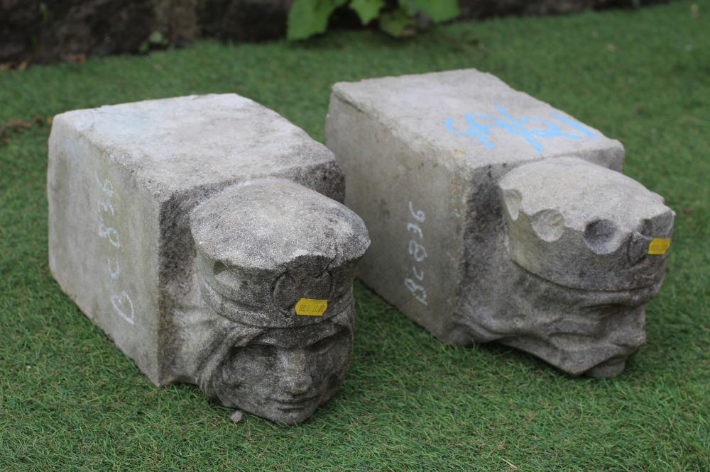 A PAIR OF CAST STONE FIGURAL CORBELS modelled as the heads of a King and Queen, 6" w x 12" d x 6 Image