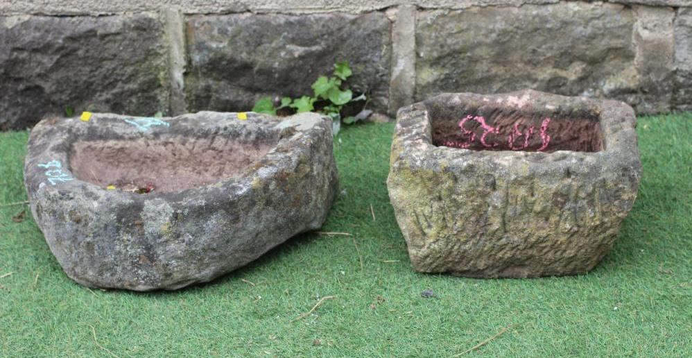 A SMALL SANDSTONE TROUGH of rough hewn D form, 18 1/2" w x 5 1/2" d x 12" h, together with another Image