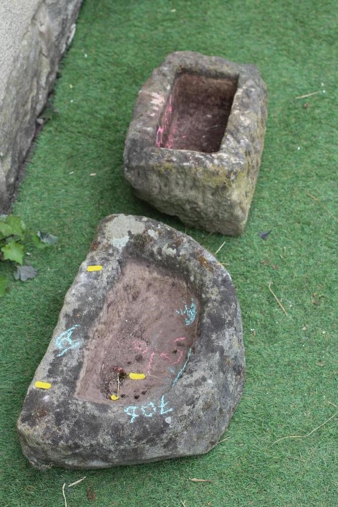 A SMALL SANDSTONE TROUGH of rough hewn D form, 18 1/2" w x 5 1/2" d x 12" h, together with another Image