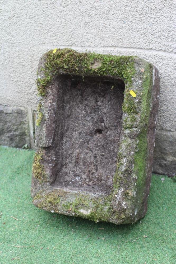 A SANDSTONE TROUGH of rough hewn oblong form, 22 1/2" w x 16" d x 9" h (Est. plus 24% premium inc. Image