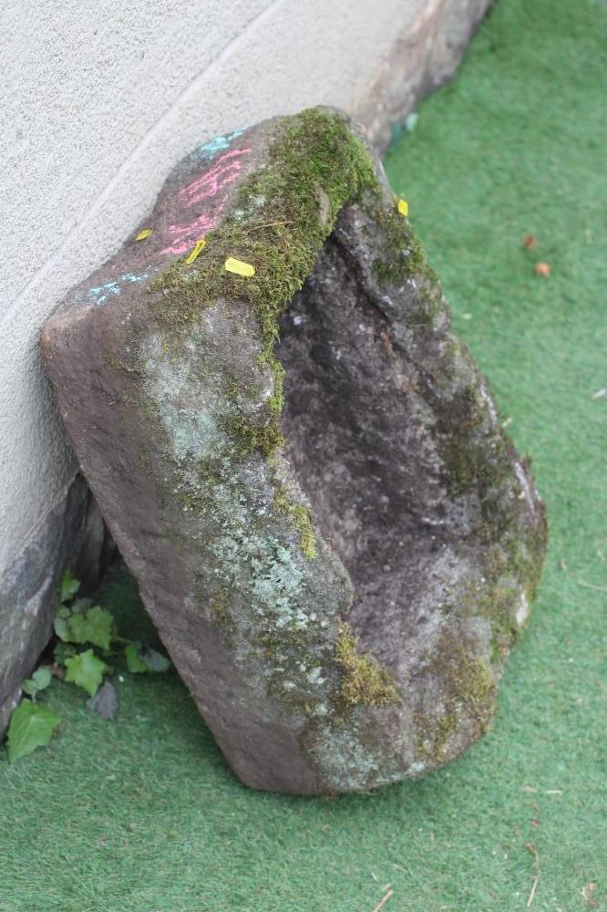 A SANDSTONE TROUGH of rough hewn oblong form, 22 1/2" w x 16" d x 9" h (Est. plus 24% premium inc. Image
