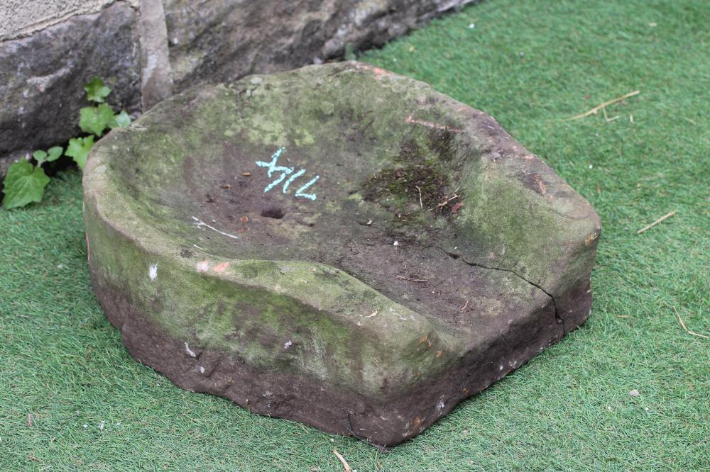 A SANDSTONE WATER FEATURE of horseshoe open ended form with small central aperture, 21 1/2" w x 18" Image