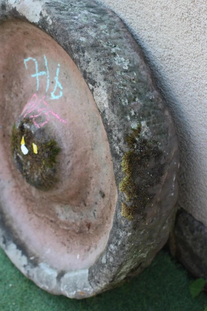 A SANDSTONE PIG TROUGH of well cut circular form with central boss, 28" w x 6" h (Est. plus 24% Image