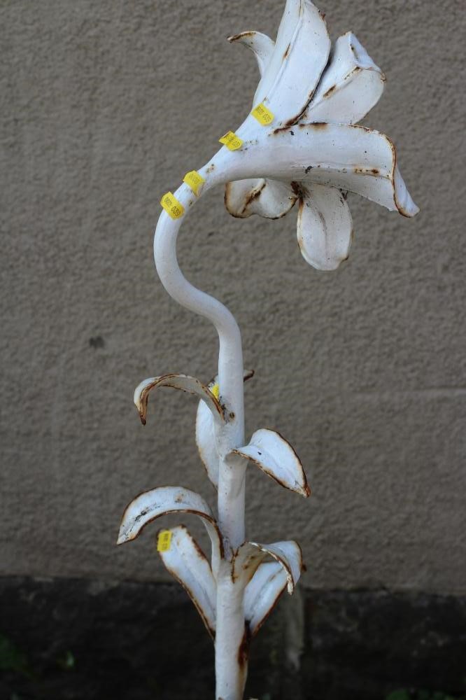 A CAST IRON FOUNTAINHEAD, modelled as a single flowerhead with tubular stem issuing leaves, on Image