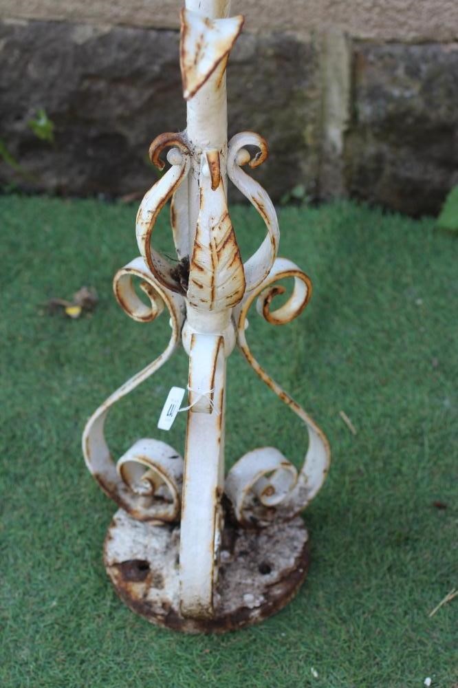 A CAST IRON FOUNTAINHEAD, modelled as a single flowerhead with tubular stem issuing leaves, on Image