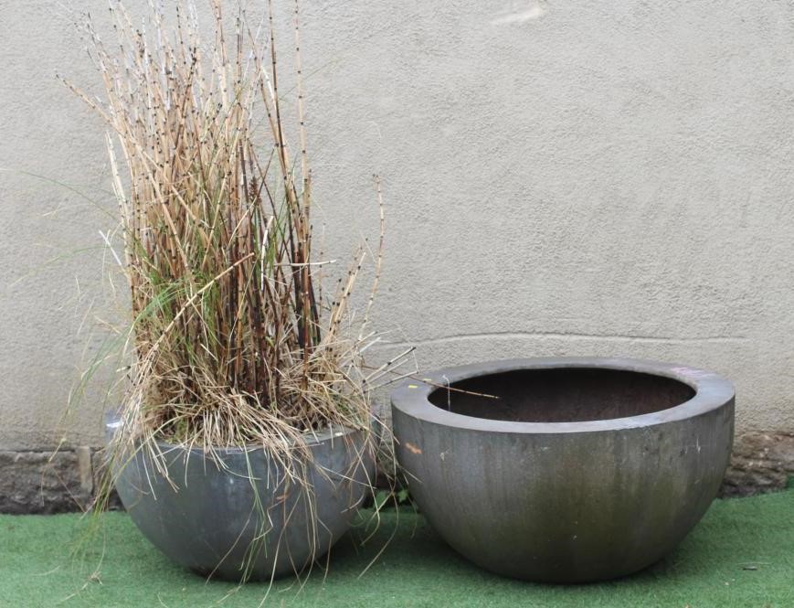 A LARGE COMPOSITION PLANTER of circular tapering form with flat rim, 37 1/4" w x 19" h, together Image