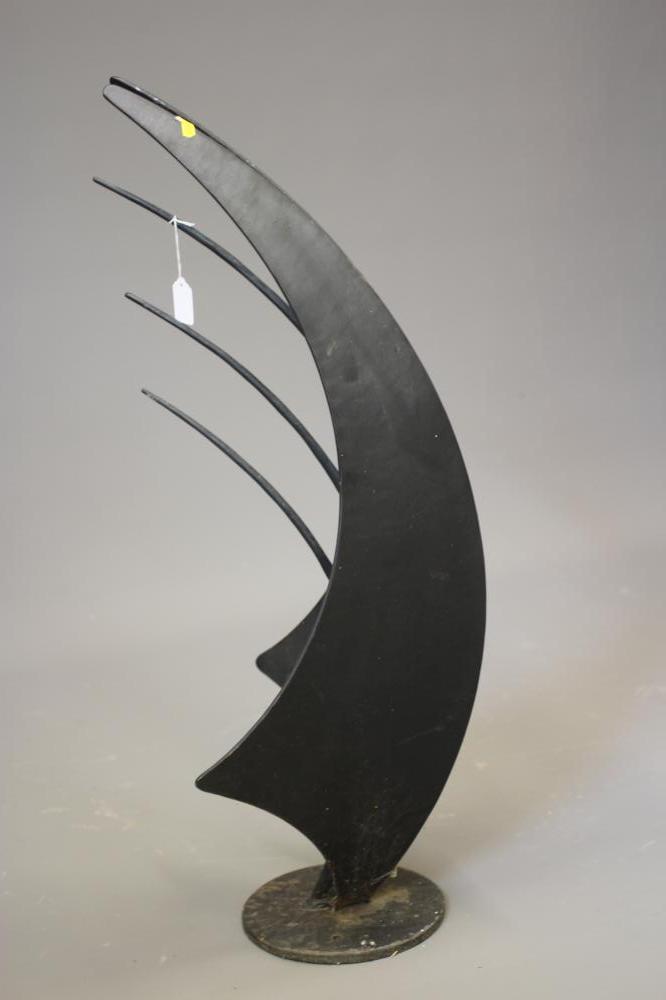 A BLACK PATINATED METAL ABSTRACT SCULPTURE, modern, of curved angular form set on a circular base, Image
