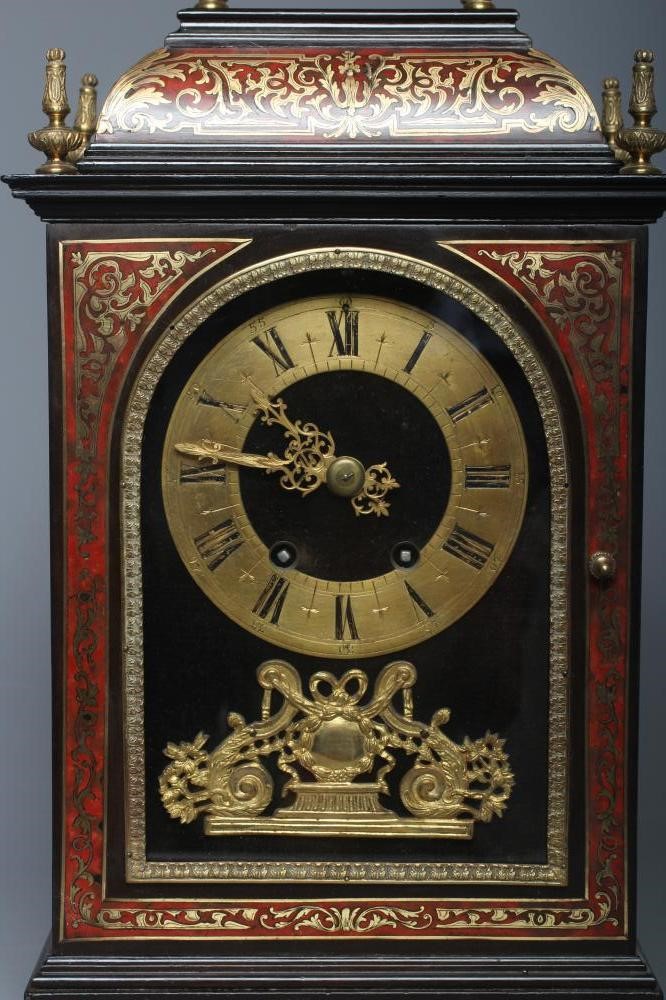 AN EBONISED MANTEL CLOCK Image