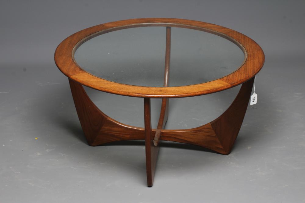 V B WILKINS FOR GPLAN - A TEAK ASTRO COFFEE TABLE, the circular top with inset clear glass panel, Image