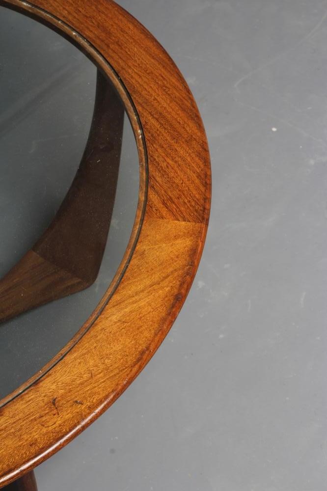 V B WILKINS FOR GPLAN - A TEAK ASTRO COFFEE TABLE, the circular top with inset clear glass panel, Image