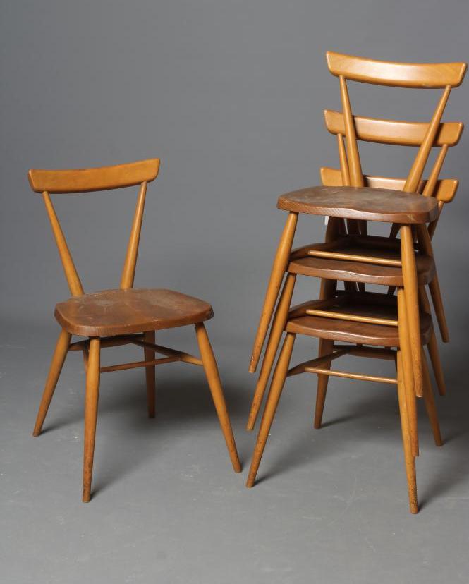 A SET OF FOUR ERCOL BLOND ELM MODEL 392 ADULT STACKING CHAIRS Image