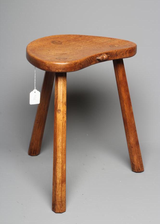 ROBERT THOMPSON - AN ADZED OAK STOOL Image