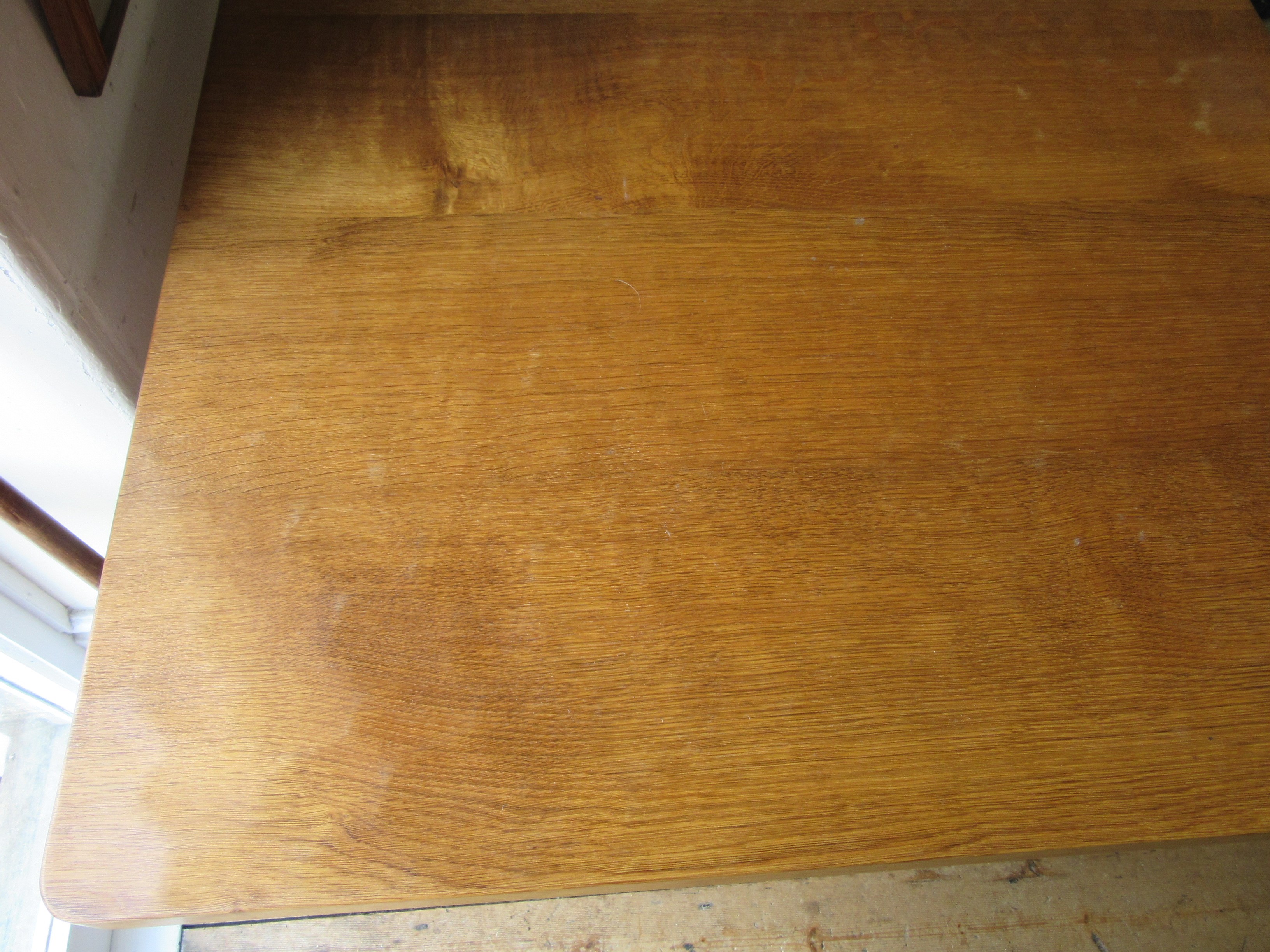 ROBERT THOMPSON - AN ADZED OAK DINING TABLE Image