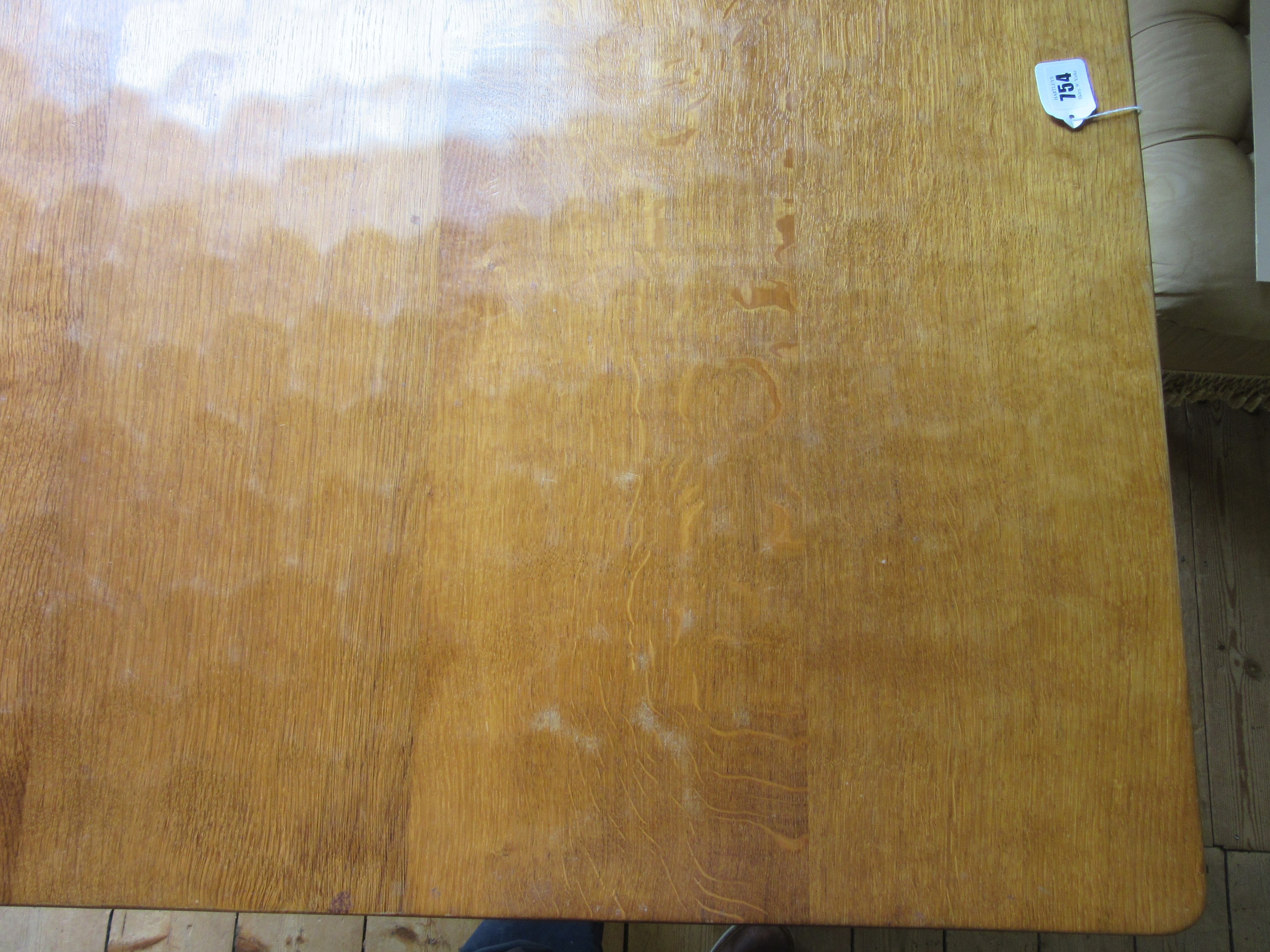 ROBERT THOMPSON - AN ADZED OAK DINING TABLE Image