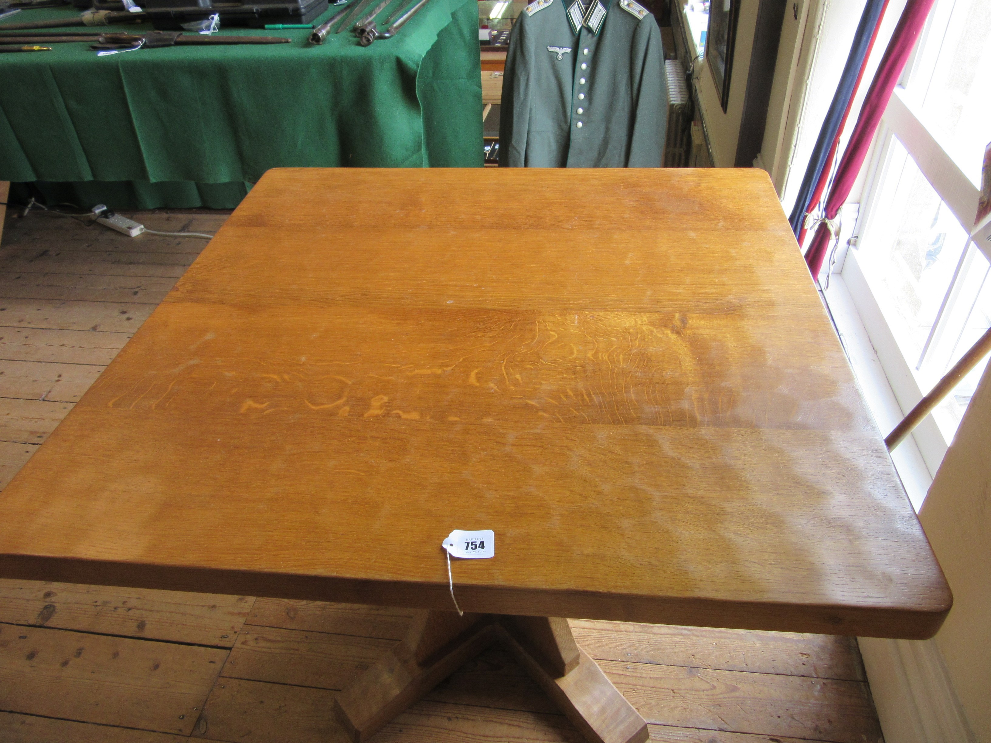 ROBERT THOMPSON - AN ADZED OAK DINING TABLE Image