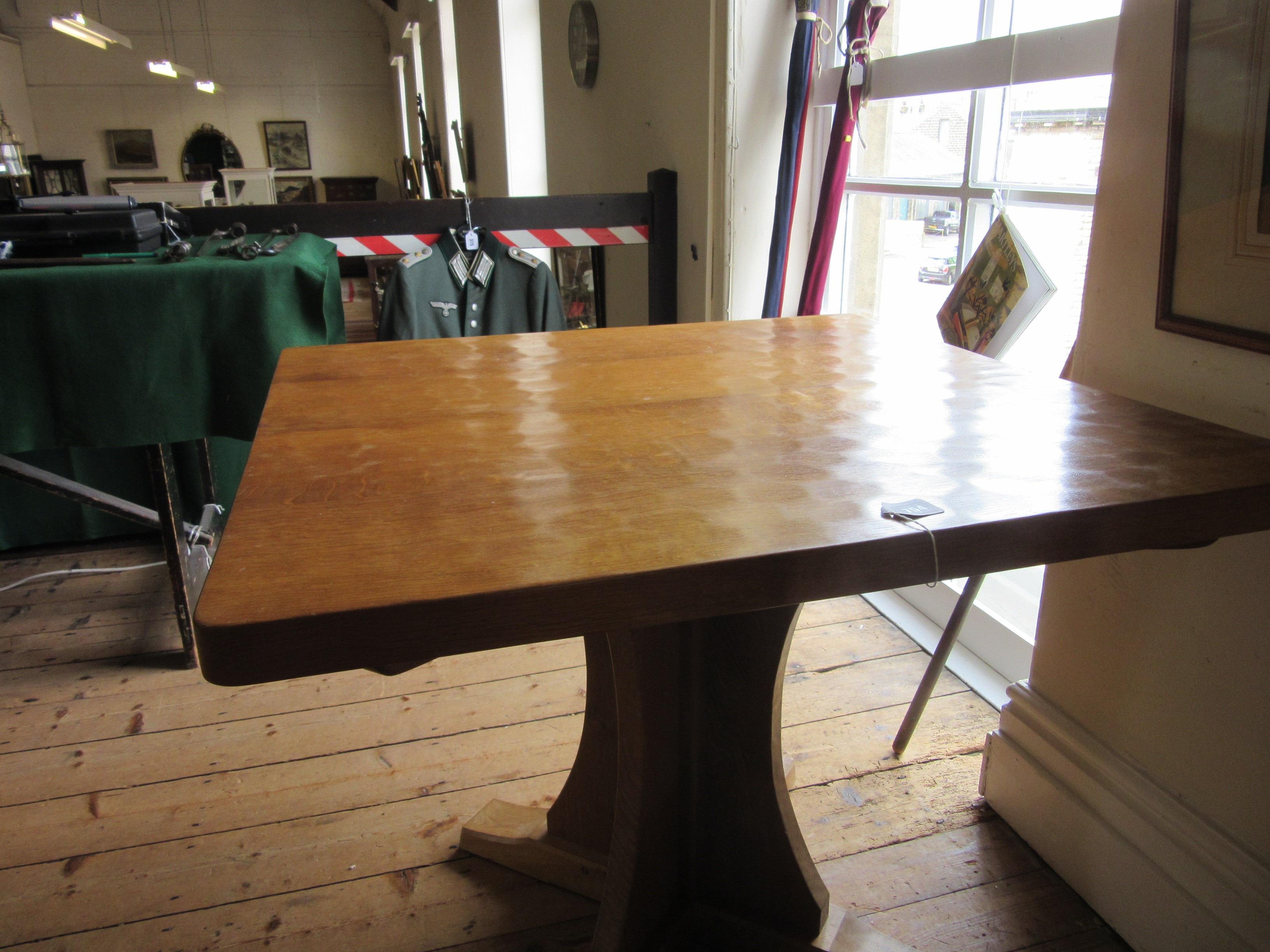ROBERT THOMPSON - AN ADZED OAK DINING TABLE Image