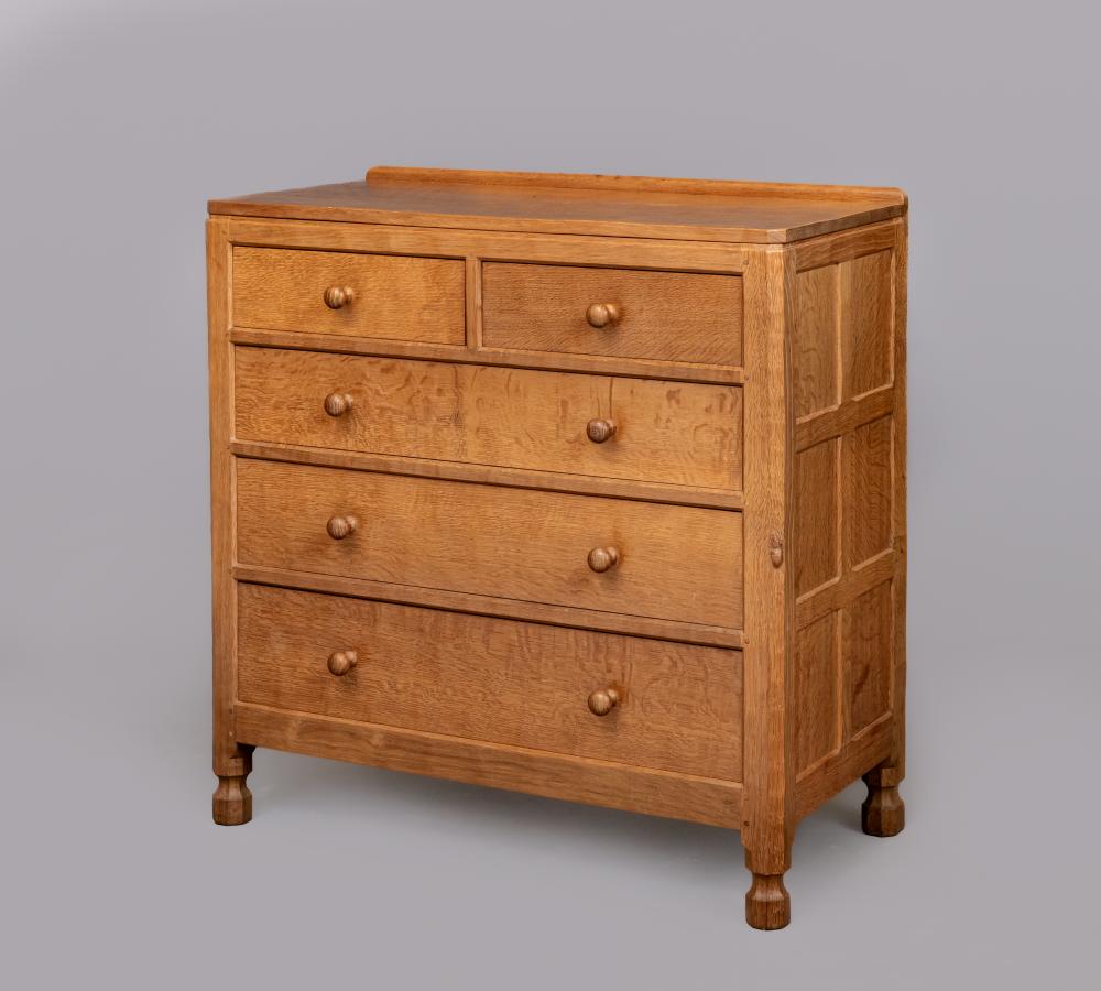 ROBERT THOMPSON - AN ADZED OAK CHEST of canted oblong form with ledge back Image