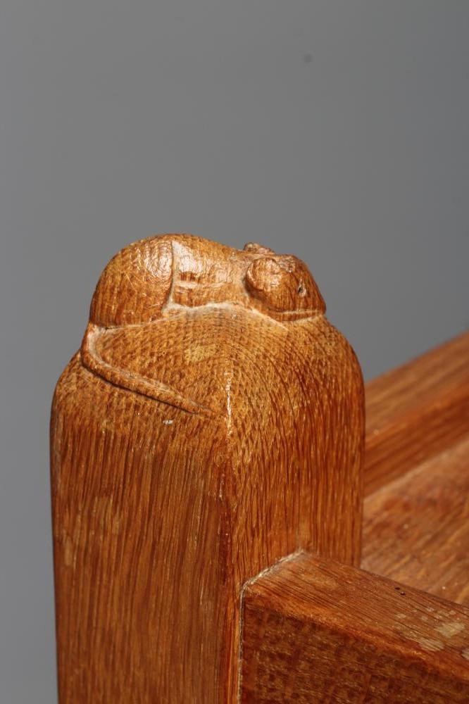 ROBERT THOMPSON - AN OAK TWO TIER TEA TROLLEY on square section uprights with pointed finials Image
