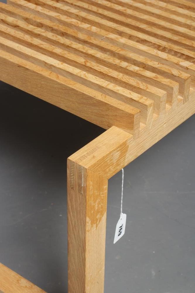 NIELS HVASS FOR FRITZ HANSEN SKAGERAK - AN OAK CUTTER BENCH, modern, the slatted oblong seat on Image