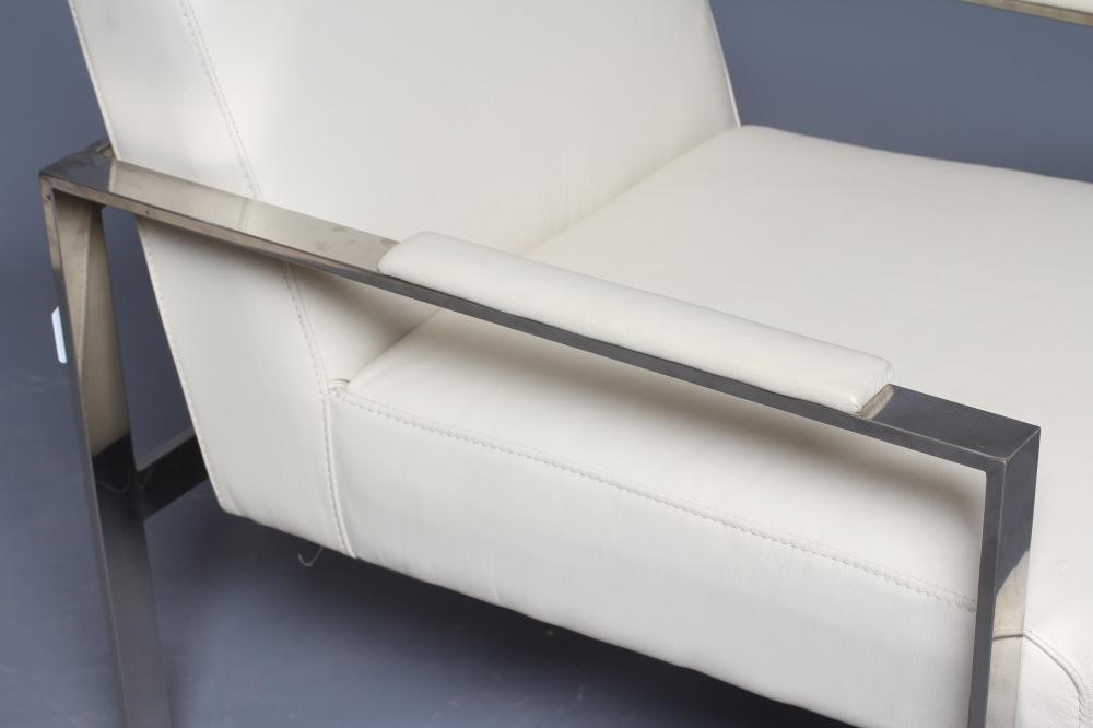 A CHROME AND CREAM LEATHERETTE ARMCHAIR, modern, the square section frame with padded arms, 23" w x Image