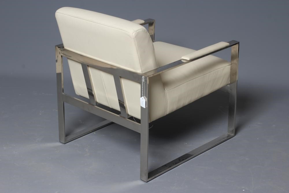 A CHROME AND CREAM LEATHERETTE ARMCHAIR, modern, the square section frame with padded arms, 23" w x Image