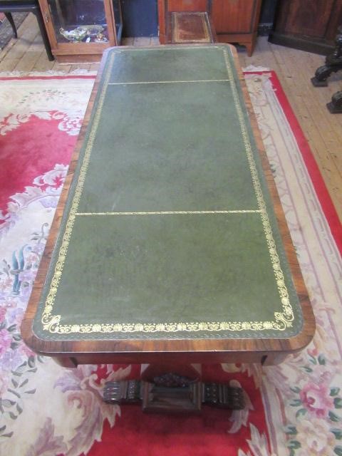 A REGENCY ROSEWOOD PILLAR END LIBRARY TABLE Image