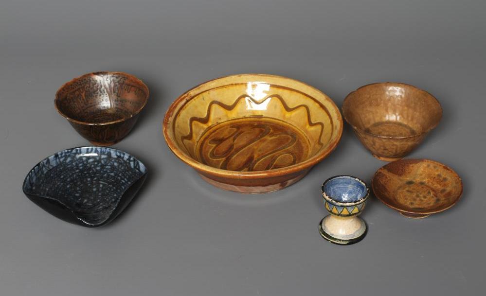 A ST. IVES POTTERY EGG CUP later painted in pale ochre Image
