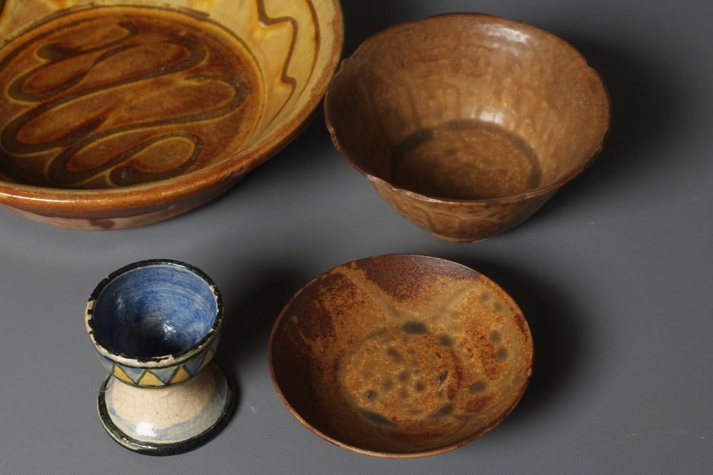 A ST. IVES POTTERY EGG CUP later painted in pale ochre Image