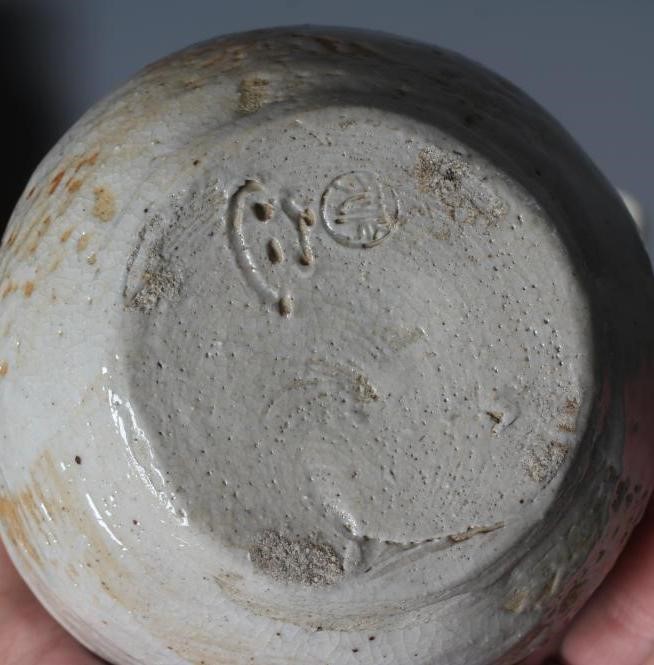 A COLLECTION OF JAPANESE VASES AND BOWLS including a pale celadon glazed globular vase with incised Image