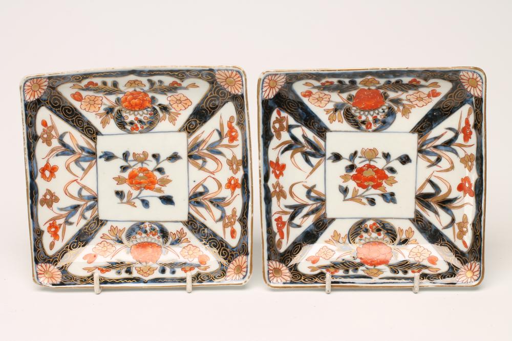A PAIR OF IMARI PORCELAIN SQUARE DISHES painted in typical palette with panels of iris and potted Image