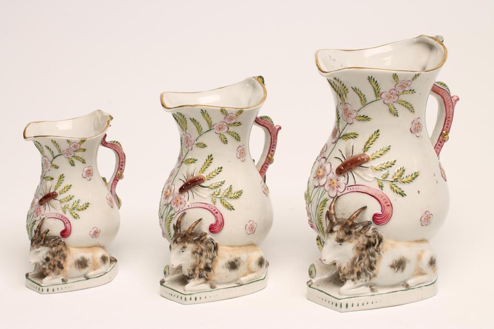 A GRADUATED SET OF THREE CONTINENTAL PORCELAIN "GOAT AND BEE" JUGS Image