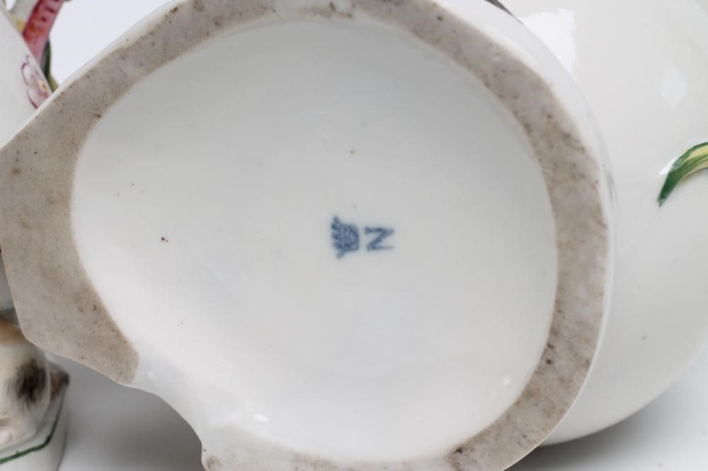 A GRADUATED SET OF THREE CONTINENTAL PORCELAIN "GOAT AND BEE" JUGS Image