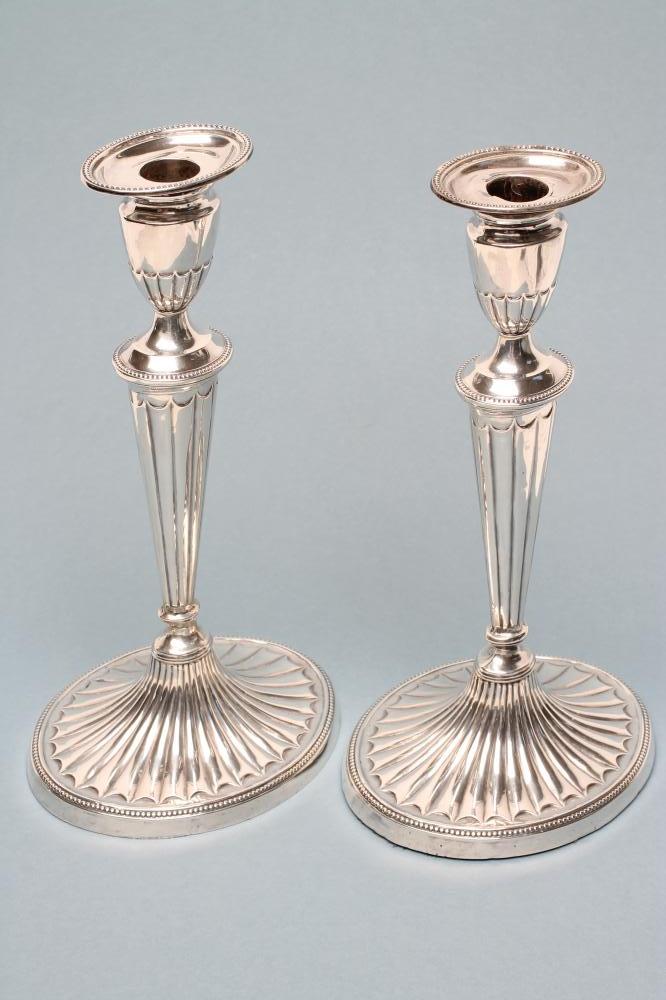 A PAIR OF LATE VICTORIAN SILVER CANDLESTICKS Image