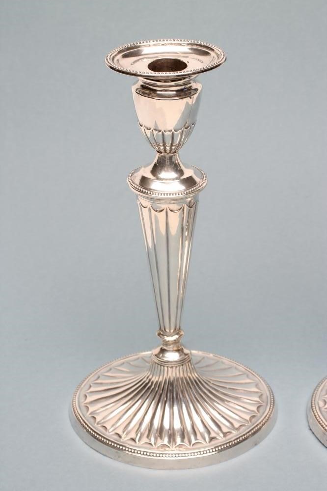 A PAIR OF LATE VICTORIAN SILVER CANDLESTICKS Image
